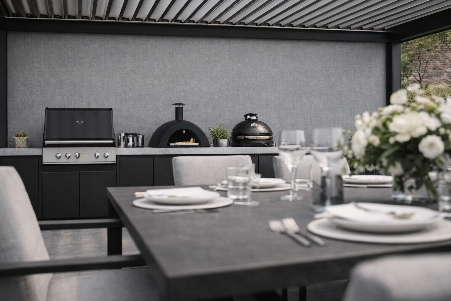 Luxury outdoor dining pavilion with pergola, kitchen wall and dining table